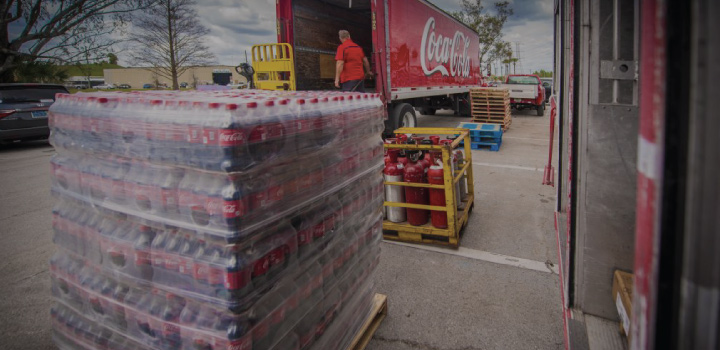 Coca-Cola truck with cases of bottled beverages